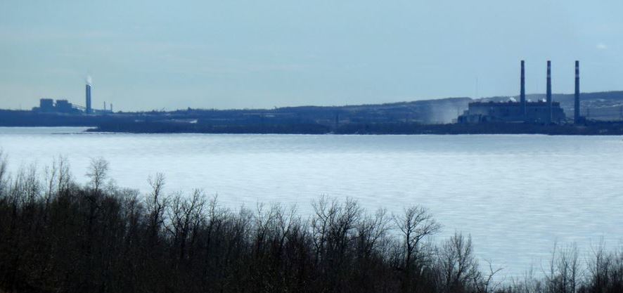 Figure 20.19 The Highvale Mine (background) and the Sundance (right) and Keephills (left) generating stations on the southern shore of Wabamun Lake, Alberta [SE]