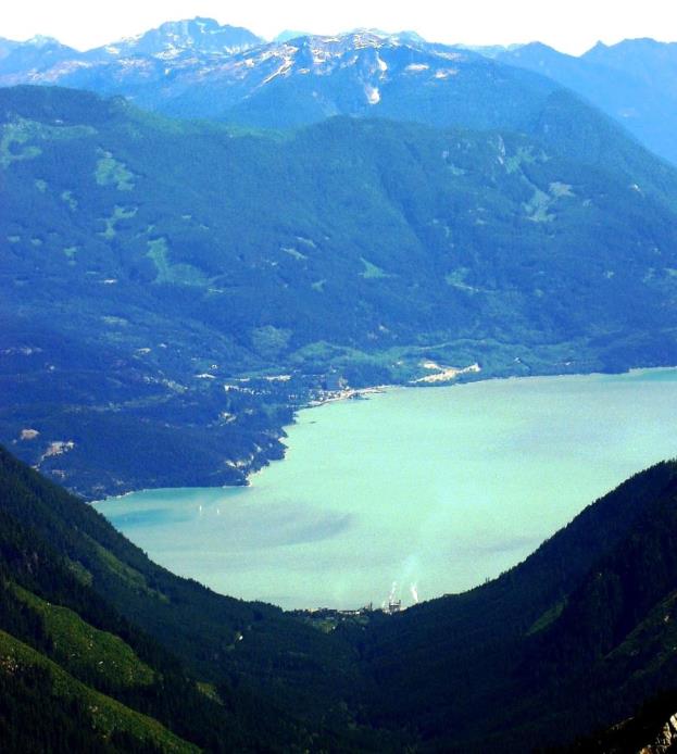 Figure 16.21 The view down the U-shaped valley of Mill Creek valley toward the U-shaped valley of Howe Sound, with the village of Britannia on the opposite side. [http://commons.wikimedia.org/wiki/File:Woodf1a.jpg]