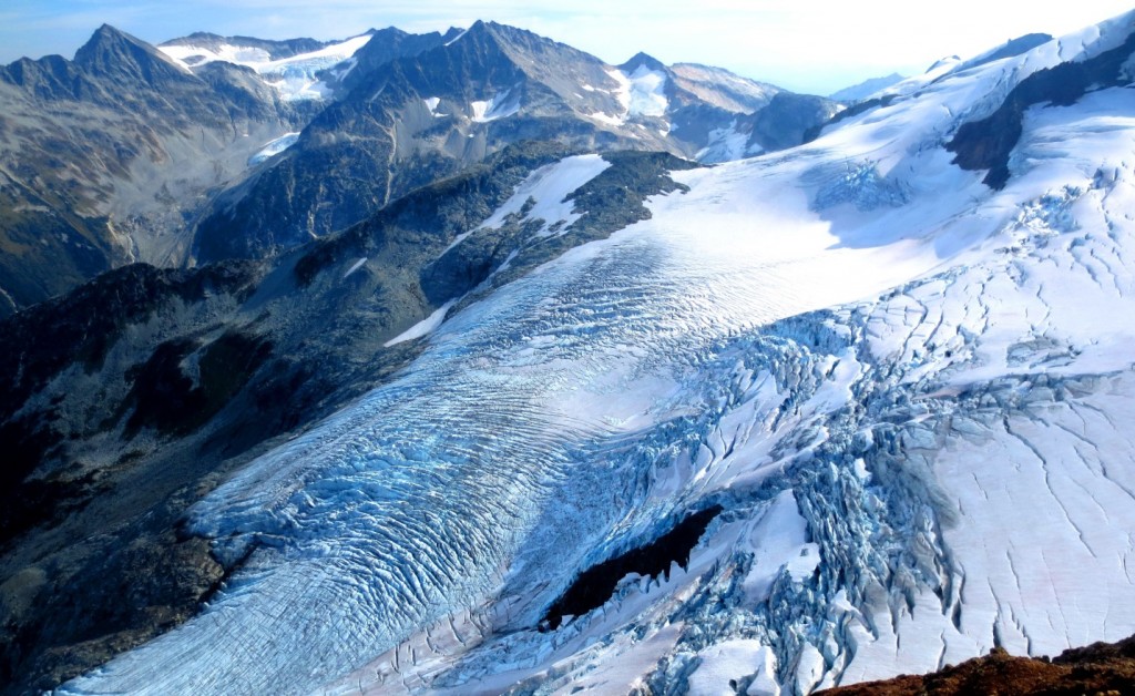 Figure 21.33 Various glacial erosion features (top left) and glaciation at the Overlord Glacier, Coast Mountains, B.C. [Isaac Earle, used with permission]