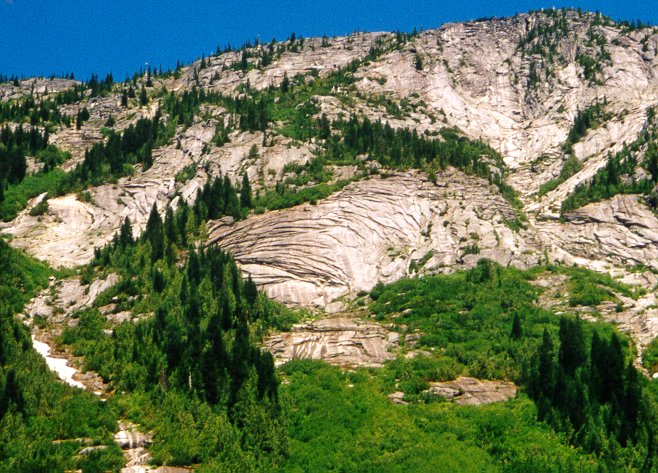 Photograph of xfoliation fractures in granitic rock exposed on the west side of the Coquihalla Highway north of Hope, BC.