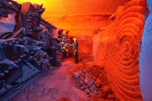 Figure 6.16 A mining machine at the face of potash ore (sylvite) in the Lanigan Mine near Saskatoon, Saskatchewan. The mineable potash layer is about 3 m thick.