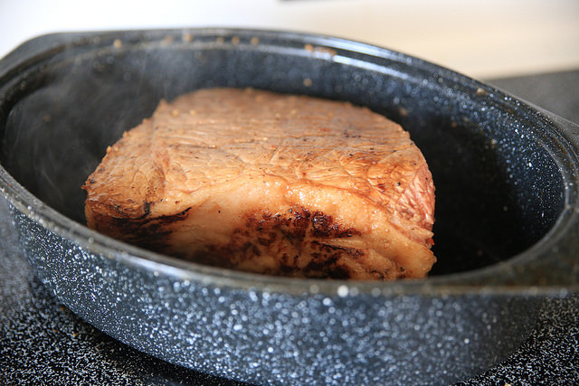 image of a roasting pan that is 5-6 inches deep and is roasting a piece of meat