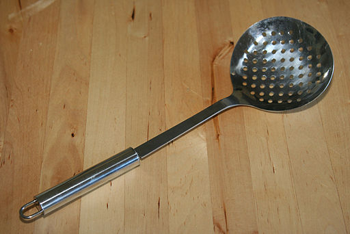 image of a skimmer spoon that has little holes to strain liquids