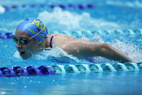 A swimmer competing in a swim meet.