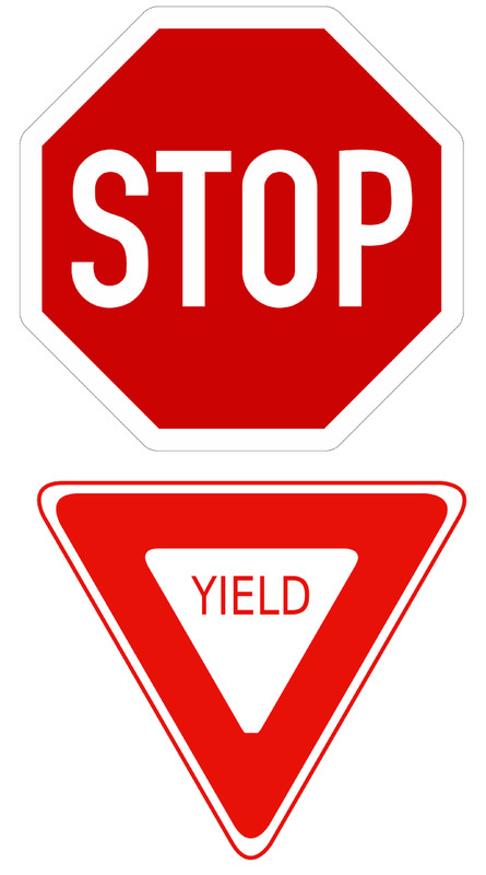 A stop sign and a yield sign.