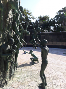 Holocaust Memorial: Miami Beach, Florida. Close-up life-sized bronze-cast sculptures of Holocaust survivors lifting children up to safety.