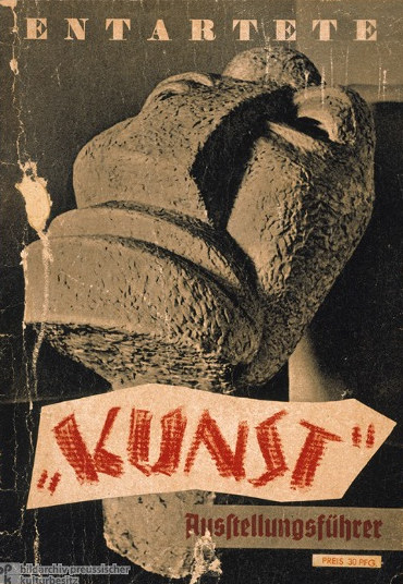 The title “Kunst” [art] is placed in quotation marks thereby questioning the ethical and aesthetic validity of the exhibited works. The sculpture Large Head by Jewish artist Otto Freundlich (1878-1943) was to represent everything wrong with modernist art.