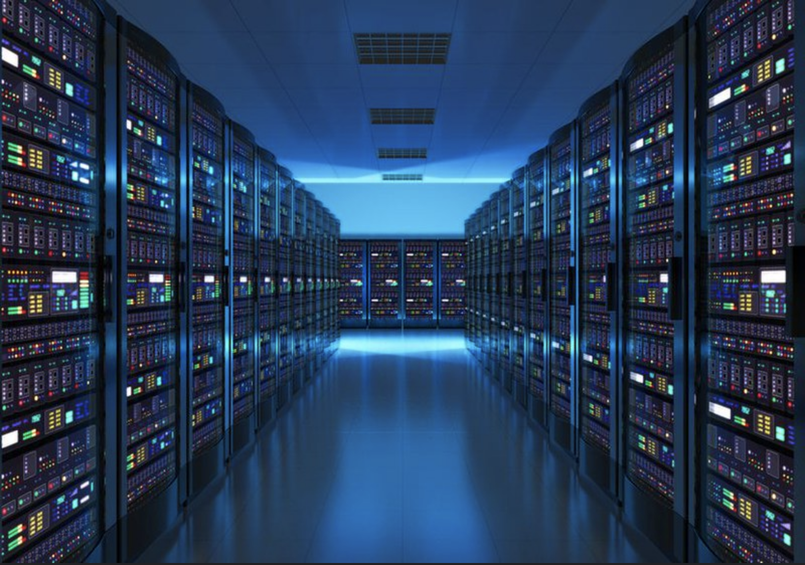 An image of a dim room in the middle of a server farm aisle.