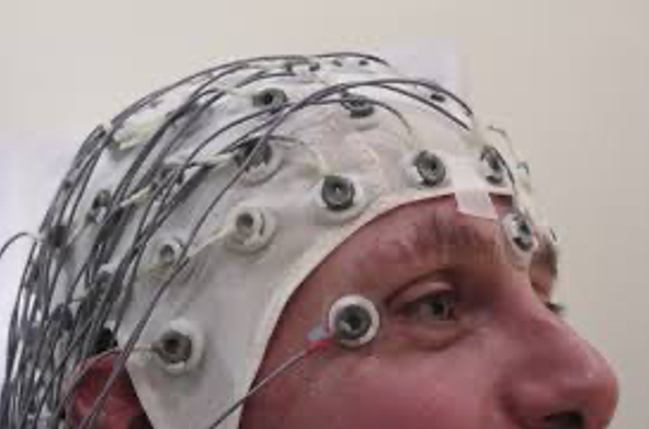An image of a person with EEG headcap on