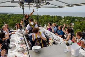 People dining at a pop-up dinner in the sky