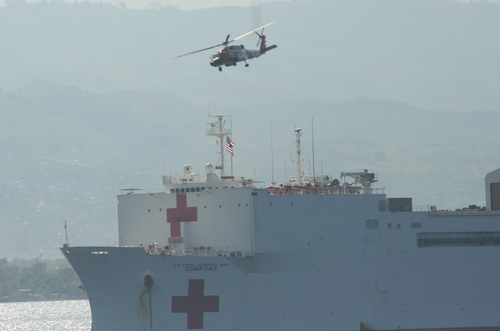USNS Comfort Red Cross ship and a helicopter in Haiti.