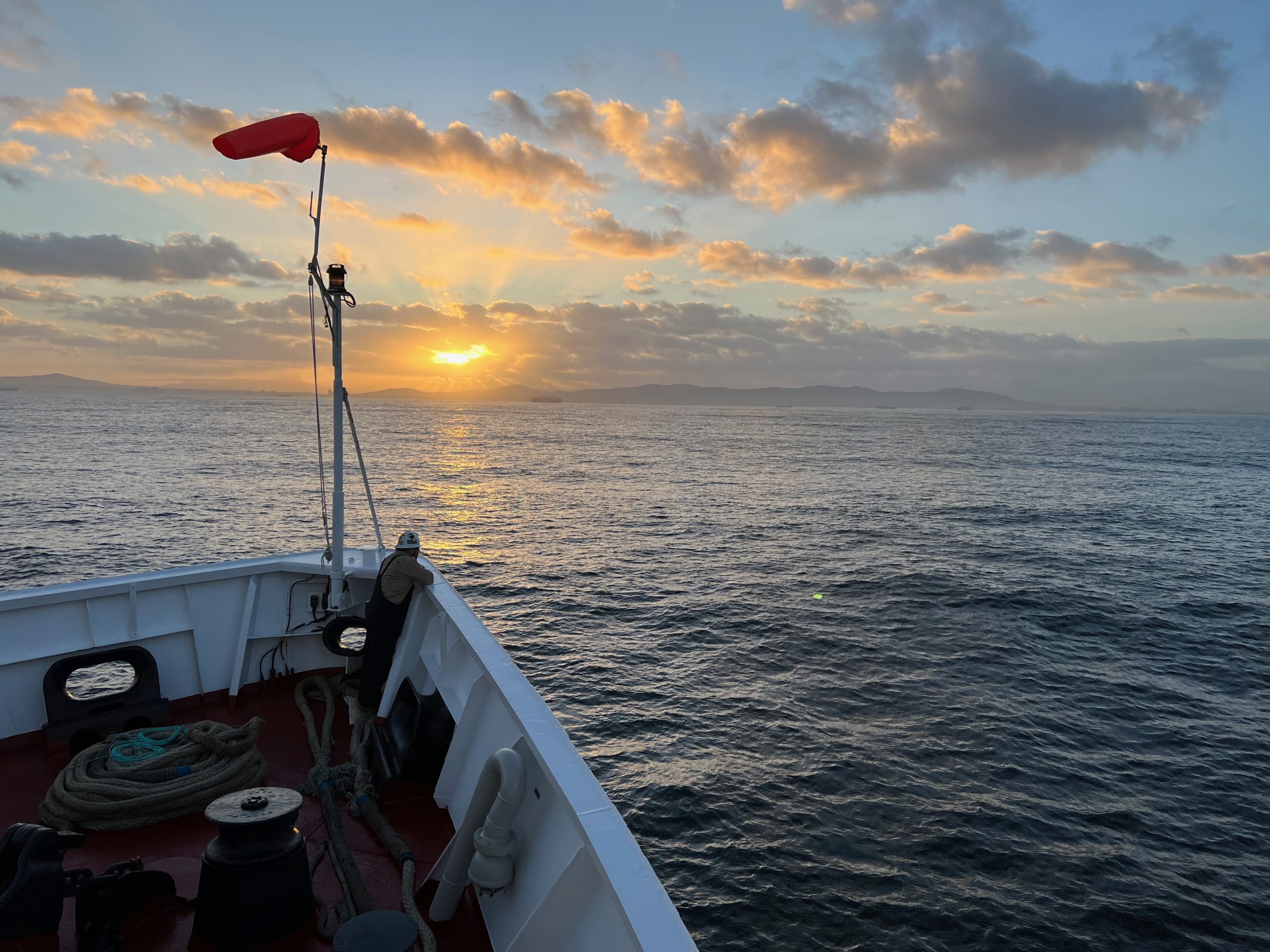 ship on the ocean at sunset