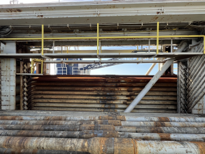 Lateral view of multiple stacks of metal pipes