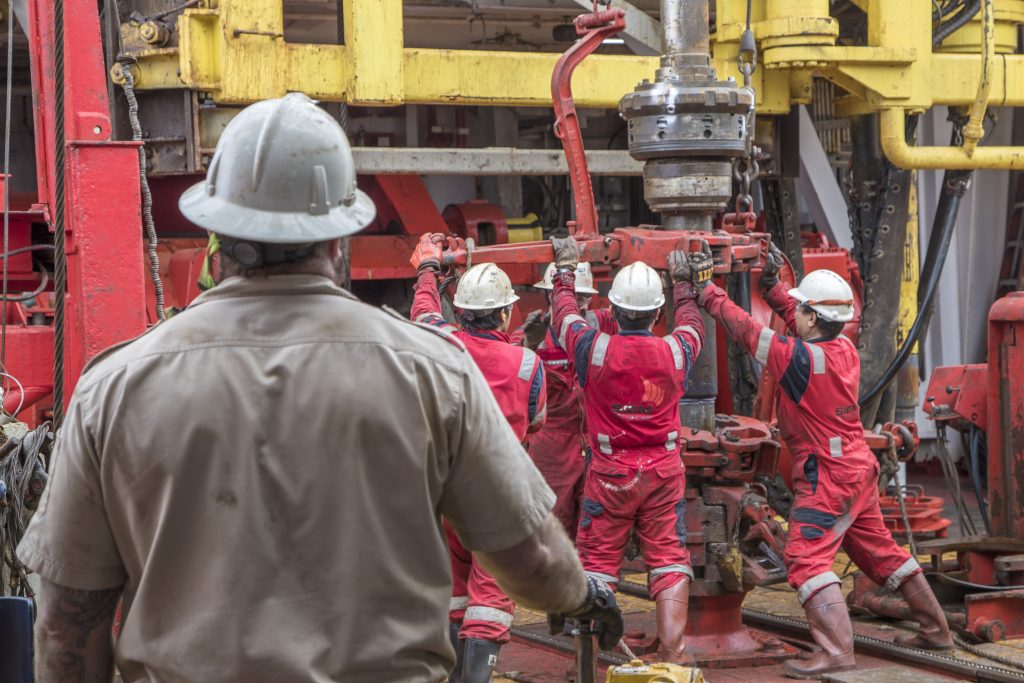 people working on a drill ship