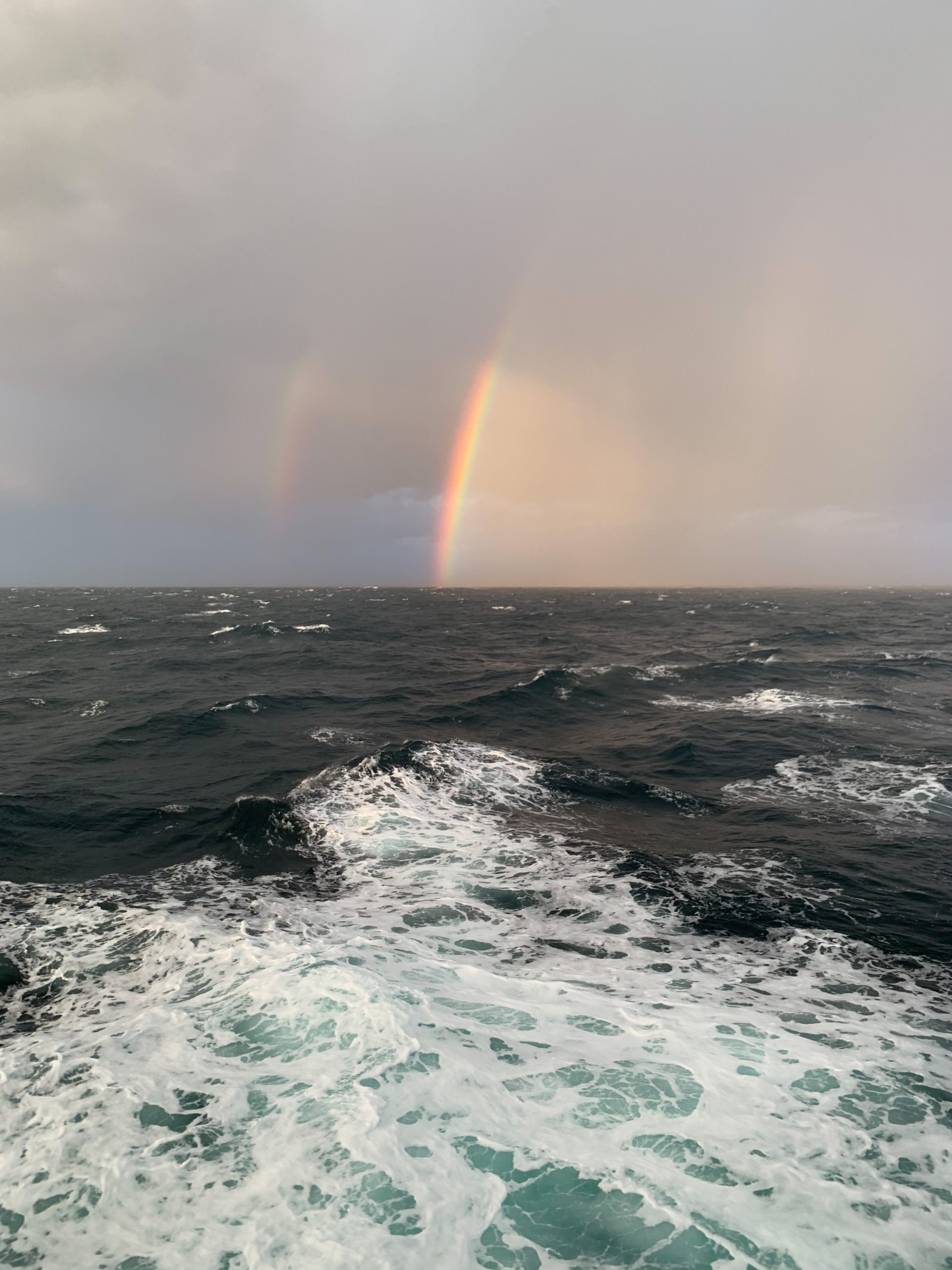 half a rainbow over the ocean