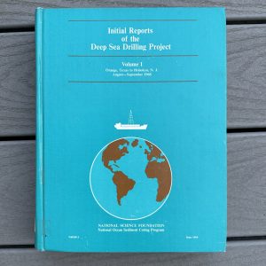 turquoise book cover with white lettering and a sketch of Planet Earth