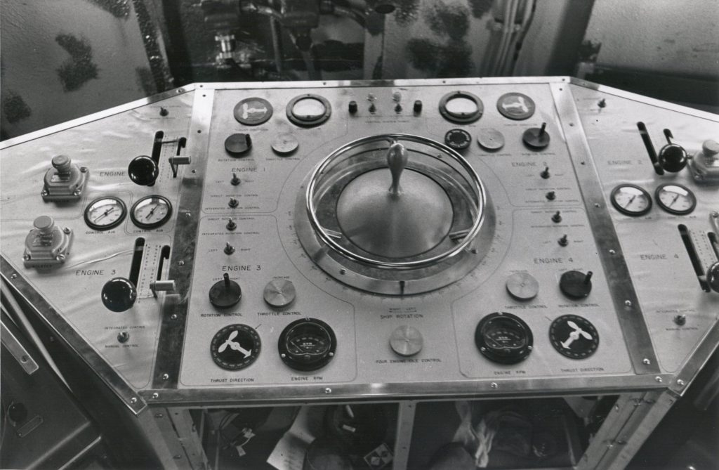 Console with dials and a joystick in the middle for steering