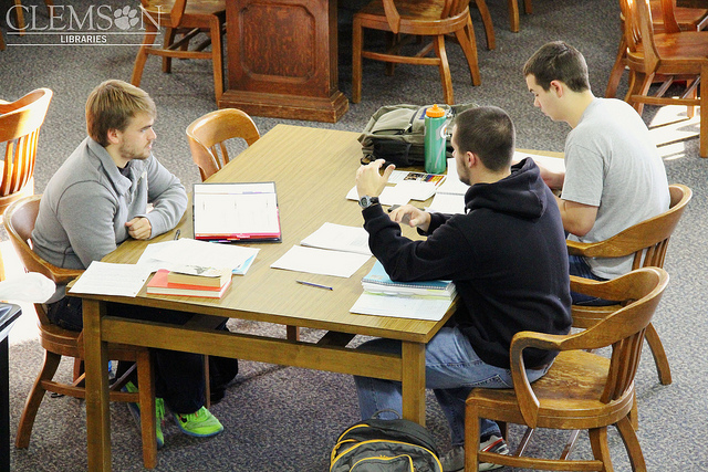 A study group going over material at a library